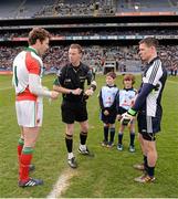 14 April 2013; Referee Joe McQuillan tosses the coin between Mayo captain David Clarke, left, and Dublin captain Stephen Cluxton, watched by match day mascots Daniel Brodrick and Matthew Sherlock. Allianz Football League, Division 1, Semi-Final, Dublin v Mayo, Croke Park, Dublin. Picture credit: Ray McManus / SPORTSFILE
