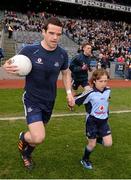 14 April 2013; Match day mascot Matthew Sherlock, Raheny, Co. Dublin, and Dublin's Ger Brennan as they run on to the pitch for the game. Allianz Football League, Division 1, Semi-Final, Dublin v Mayo, Croke Park, Dublin. Picture credit: Ray McManus / SPORTSFILE