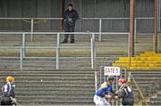 14 April 2013; A spectator looks on from the stand during the game. Allianz Hurling League, Division 3B, Final, Longford v Sligo, Sean McDermott Park, Carrick-on-Shannon, Co. Leitrim. Picture credit: David Maher / SPORTSFILE