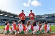 16 April 2013; Former Galway footballer Padraic Joyce, left, and current Dublin footballer Rory O'Carroll with children from Castleknock, Dublin, at the national launch of the Kellogg’s Cúl Camps 2013. Croke Park, Dublin. Picture credit: Brendan Moran / SPORTSFILE