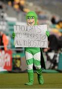 16 April 2013; Shamrock Rovers mascot Hooperman displays a sign dedicated to the victims of the Boston bombings. Setanta Sports Cup, Semi-Final, First Leg, Shamrock Rovers v Cork City, Tallaght Stadium, Tallaght, Co. Dublin. Picture credit: David Maher / SPORTSFILE