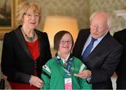 18 April 2013; Team Ireland alpine skiing athlete Rosalind Connolly, from Portadown, Co. Armagh, with President of Ireland Michael D. Higgins and his wife Sabina at a reception for the Special Olympics World Winter Games squad in Aras an Uachtarain, Phoenix Park, Dublin. Picture credit: Barry Cregg / SPORTSFILE