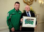 18 April 2013; Team Ireland floorball athlete George Fitzgerald, from Waterford City, makes a presentation on behalf of Team Ireland, to President of Ireland Michael D. Higgins at a reception for the Special Olympics World Winter Games squad in Aras an Uachtarain, Phoenix Park, Dublin. Picture credit: Ray McManus / SPORTSFILE