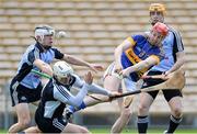 21 April 2013; Shane Bourke, Tipperary, shoots to score his side's first goal despite the efforts of Ruairi Trainor, left, and Alan Nolan, Dublin. Allianz Hurling League, Division 1, Semi-Final, Tipperary v Dublin, Semple Stadium, Thurles, Co. Tipperary. Picture credit: Brian Lawless / SPORTSFILE