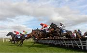 23 April 2013; Runners and riders jump the last 'first time around' during the bragbet.com Handicap Hurdle. Punchestown Racecourse, Punchestown, Co. Kildare. Picture credit: Stephen McCarthy / SPORTSFILE