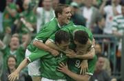 11 June 2003; Gary Doherty, Republic of Ireland, is congratulated by team-mates  Gary Breen, left, Robbie Keane, and Colin Healy, top, after scoring his sides opening goal. 2004 European Championship Qualifier, Republic of Ireland v Georgia, Lansdowne Road, Dublin. Soccer. Picture credit; David Maher / SPORTSFILE *EDI*