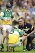 8 June 2003; Mike McNamara, Offaly manager, attends to Ger Oakley, Offaly. Guinness Leinster Senior Hurling Championship, Offaly v Wexford, Nowlan Park, Kilkenny. Picture credit; Damien Eagers / SPORTSFILE *EDI*