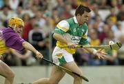 8 June 2003; Colm Cassidy, Offaly, in action against Wexford's Michael Jordan. Guinness Leinster Senior Hurling Championship, Offaly v Wexford, Nowlan Park, Kilkenny. Picture credit; Damien Eagers / SPORTSFILE *EDI*