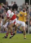 14 June 2003; Brian McFall of Antrim in action against Pauly McVeigh of Derry during the Guinness Ulster Senior Hurling Championship Final between Antrim and Derry at Casement Park in Belfast. Photo by Damien Eagers/Sportsfile