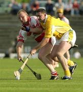 14 June 2003; Jim Connolly of Antrim in action against Gergory Biggs of Derry during the Guinness Ulster Senior Hurling Championship Final between Antrim and Derry at Casement Park in Belfast. Photo by Damien Eagers/Sportsfile