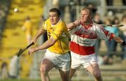 14 June 2003; Kieran Kelly of Antrim in action against Gregory Biggs of Derry during the Guinness Ulster Senior Hurling Championship Final between Antrim and Derry at Casement Park in Belfast. Photo by Damien Eagers/Sportsfile