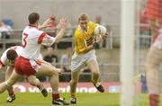 15 June 2003; Kevin McGourty, Antrim, in action against Tyrone's Colin Holmes and Conor Gormley. Bank of Ireland Ulster Senior Football Championship, Tyrone v Antrim, Casement Park, Belfast. Picture credit; David Maher / SPORTSFILE *EDI*