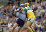 15 June 2003; Kevin Flynn of Dublin in action against Ger Oakley of Offaly during the Guinness All Ireland Hurling Championship Qualifier Round 1 match between Dublin and Offaly at Croke Park in Dublin. Photo by Ray McManus/Sportsfile