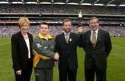 15 June 2003; Special Olympics Athlete Mattew O'Neill, from Portmarnock, Dublin, with Mary Davis, CEO, 2003 Special Olympics World Games, who presented a Torch to the GAA President Sean Kelly and Director General Liam Mulvihill in recognition of the GAA's support of the Games ahead of the Bank of Ireland Leinster Senior Football Championship Semi-Final match between Dublin and Laois at Croke Park in Dublin. Photo by Ray McManus/Sportsfile