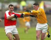 21 June 2003; Armagh's Barry O Hagan in action against Antrim's Rory O Loane. Bank of Ireland Senior Football Championship qualifier, Antrim v Armagh, Casement Park, Belfast. Picture credit; Oliver McVeigh / SPORTSFILE *EDI*