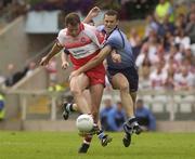 28 June 2003; Anthony Tohill, Derry, in action against Ciaran Whelan, Dublin. Bank of Ireland Senior Football Championship qualifier, Derry v Dublin, St. Tighernach's Park, Clones, Co. Monaghan. Picture credit; David Maher / SPORTSFILE *EDI*