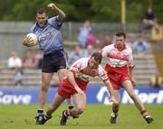 28 June 2003; Ciaran Whelan of Dublin in action against Anthony Tohill and Paul McFlynn of Derry during the Bank of Ireland All Ireland Senior Football Championship Qualifier match between Derry and Dublin at St Tiernach’s Park in Clones, Monaghan. Photo by Damien Eagers/Sportsfile