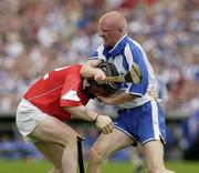 29 June 2003; John Mullane of Waterford tussles with Wayne Sherlock of Cork during the Guinness Munster Senior Hurling Championship Final match between Cork and Waterford at Semple Stadium in Thurles, Tipperary. Photo by David Maher/Sportsfile