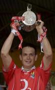 29 June 2003; Cork captain Alan Browne lifts the cup after the Guinness Munster Senior Hurling Championship Final match between Cork and Waterford at Semple Stadium in Thurles, Tipperary. Photo by Pat Murphy/Sportsfile