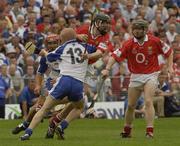 29 June 2003; Pat Mulcahy of Cork in action against John Mullane of Waterford during the Guinness Munster Senior Hurling Championship Final match between Cork and Waterford at Semple Stadium in Thurles, Tipperary. Photo by Pat Murphy/Sportsfile