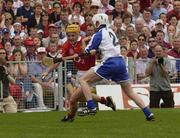 29 June 2003; Joe Deane of Cork in action against Brian Greene of Waterford during the Guinness Munster Senior Hurling Championship Final match between Cork and Waterford at Semple Stadium in Thurles, Tipperary. Photo by Pat Murphy/Sportsfile