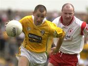 15 June 2003; Kevin Madden, Antrim, in action against Tyrone's Chris Lawn. Bank of Ireland Ulster Senior Football Championship, Tyrone v Antrim, Casement Park, Belfast. Picture credit; David Maher / SPORTSFILE *EDI*