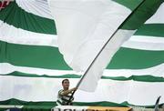 13 June 2003; A Shamrock Rovers supporters waves a flag during the Eircom League Premier Division match between Shamrock Rovers and St Patrick's Athletic at Richmond Park in Dublin. Photo by David Maher/Sportsfile