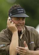 30 June 2003; Darren Clarke of Northern Ireland on the phone during a practice round in preparation for The Smurfit European Open at the K Club in Straffan, Kildare. Photo by Damien Eagers/Sportsfile