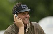 30 June 2003; Darren Clarke of Northern Ireland on a phone call during a practice round in preparation for The Smurfit European Open at the K Club in Straffan, Kildare. Photo by Damien Eagers/Sportsfile