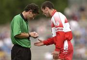 28 June 2003; Sean Martin Lockhart of Derry remonstrates with referee Brian White during the Bank of Ireland All Ireland Senior Football Championship Qualifier match between Derry and Dublin at St Tiernach’s Park in Clones, Monaghan. Photo by Damien Eagers/Sportsfile