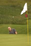 1 July 2003; Ireland rugby international Keith Wood plays out of a bunker on to the 5th green during the Charity Pro Am ahead of The Smurfit European Open at The K Club South Course in Straffan, Kildare. Photo by Brendan Moran/Sportsfile