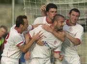1 July 2003; Dave Rogers, centre, celebrates with his Shelbourne team-mates, from left, Stephen Geoghegan, Kevin Doherty and Jason Byrne after scoring his side's first goal during the Eircom League Premier Division between Longford Town and Shelbourne at Flancare Park in Longford. Photo by David Maher/Sportsfile