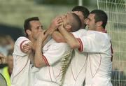 1 July 2003; Dave Rogers, centre, celebrates with his Shelbourne team-mates, from left, Stephen Geoghegan, Kevin Doherty and Jason Byrne after scoring his side's first goal during the Eircom League Premier Division between Longford Town and Shelbourne at Flancare Park in Longford. Photo by David Maher/Sportsfile