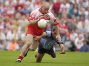 28 June 2003; Geoffrey McGonigle of Derry in action against David Henry of Dublin during the Bank of Ireland All Ireland Senior Football Championship Qualifier match between Derry and Dublin at St Tiernach’s Park in Clones, Monaghan. Photo by Damien Eagers/Sportsfile