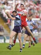 28 June 2003; Darren Homan of Dublin fields a high ball during the Bank of Ireland All Ireland Senior Football Championship Qualifier match between Derry and Dublin at St Tiernach’s Park in Clones, Monaghan. Photo by Damien Eagers/Sportsfile