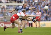28 June 2003; Shane Ryan of Dublin in action against Johnny McBride of Derry during the Bank of Ireland All Ireland Senior Football Championship Qualifier match between Derry and Dublin at St Tiernach’s Park in Clones, Monaghan. Photo by Damien Eagers/Sportsfile