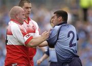 28 June 2003; David Henry of Dublin tussles with Geoffrey McGonigle of Derry during the Bank of Ireland All Ireland Senior Football Championship Qualifier match between Derry and Dublin at St Tiernach’s Park in Clones, Monaghan. Photo by Damien Eagers/Sportsfile
