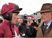 24 April 2013; Jockey Davy Russell speaking with trainer Willie Mullins after winning the Bet Online With TheTote.com Punchestown Gold Cup on Sir Des Champs. Punchestown Racecourse, Punchestown, Co. Kildare. Picture credit: Barry Cregg / SPORTSFILE