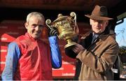 25 April 2013; Jockey Ruby Walsh and winning trainer Willie Mullins lift the trophy after winning the Ladbrokes World Series Hurdle on Quevega. Punchestown Racecourse, Punchestown, Co. Kildare. Picture credit: Barry Cregg / SPORTSFILE