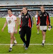 28 April 2013; A dejected Tyrone captain Stephen O'Neill, centre, who was injured in the warm up before the game, walks off after the game with PJ Quinn and Justin McMahon. Allianz Football League Division 1 Final, Dublin v Tyrone, Croke Park, Dublin. Picture credit: Oliver McVeigh / SPORTSFILE