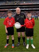 28 April 2013; 'Junior Whistlers' Ethen Keogh, left, aged 12, and Craig Fannin, aged 11, St Malachys Boys National School, Edenmore, with match referee Marty Duffy before the game. Allianz Football League Division 1 Final, Dublin v Tyrone, Croke Park, Dublin. Picture credit: Ray McManus / SPORTSFILE