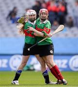 29 April 2013; The Loretto Senior Primary School, Crumlin, captain Sarah Whyte, right, and team-mate Cody Kavanagh celebrate victory over Devine Word Marley in the Allianz Corn Nuri Final. Allianz Cumann na mBunscol Finals, Loretto Senior Primary School, Crumlin v Devine Word Marley, Croke Park, Dublin. Picture credit: Ray McManus / SPORTSFILE