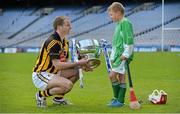 30 April 2013; Cumann na mBunscol competitor Danny Burke, age 10, from St Anne's National School, Shankill, Dublin, with Kilkenny’s JJ Delaney ahead of the Allianz Hurling League Division 1 final between Kilkenny and Tipperary which takes place in Nowlan Park, Kilkenny, on Sunday. Croke Park, Dublin. Picture credit: Brendan Moran / SPORTSFILE