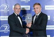 4 May 2013; Ian Madigan has been named the Bank of Ireland Leinster Players Player of the Year at the annual awards ceremony in the Mansion House, Dublin on Saturday evening. The Blackrock College out-half received the coveted award thus following in the footsteps of recent winners Gordon D'Arcy, Felipe Contepomi, Rocky Elsom, Isa Nacewa and Rob Kearney in front of over 500 guests including; players, coaches, clubs, schools, sponsors and Official Leinster Supporters Club (OLSC) members, representing all parts of the provincial game. Academy graduate Madigan has played an influential role for the province in 28 appearances to date this season (scoring 8 tries and 226 points) and has been a standout performer in Leinster's PRO12 and European campaigns. He also made his Ireland debut against France during this year's Six Nations. He is presented with his award by Damien Daly, left, Marketing Director, Bank of Ireland Group. For more information log on to www.leinsterrugby.ie. Leinster Rugby Awards Ball 2013, The Mansion House, Dublin. Picture credit: Brendan Moran / SPORTSFILE