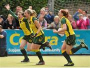 5 May 2013; Railway Union players, from left, Sinead Dooley, Kate McKenna and Emma Smyth celebrate after the game. Electric Ireland Irish Hockey League Women's Final, Loreto Hockey Club v Railway Union, Three Rock Rovers Hockey Club, Grange Road, Rathfarnham, Dublin. Picture credit: Pat Murphy / SPORTSFILE