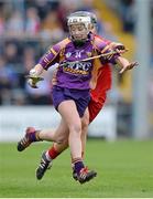 5 May 2013; Kate Kelly, Wexford, in action against Anna Geary, Cork. Irish Daily Star National Camogie League Div 1 Final, Cork v Wexford, Nowlan Park, Kilkenny. Picture credit: Brendan Moran / SPORTSFILE