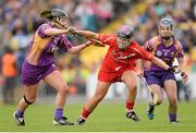 5 May 2013; Anna Geary, Cork, in action against Ursula Jacob, left, and Katrina Parrock, Wexford. Irish Daily Star National Camogie League Div 1 Final, Cork v Wexford, Nowlan Park, Kilkenny. Picture credit: Stephen McCarthy / SPORTSFILE