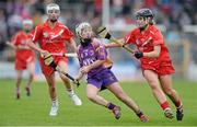5 May 2013; Kate Kelly, Wexford, in action against Anna Geary, Cork. Irish Daily Star National Camogie League Div 1 Final, Cork v Wexford, Nowlan Park, Kilkenny. Picture credit: Brendan Moran / SPORTSFILE