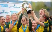 5 May 2013; Railway Union captain Emer Lucy, left, and vice-captain Jean McDonnell, right, lift the cup while their team-mates celebrate. Electric Ireland Irish Hockey League Women's Final, Loreto Hockey Club v Railway Union, Three Rock Rovers Hockey Club, Grange Road, Rathfarnham, Dublin. Picture credit: Pat Murphy / SPORTSFILE