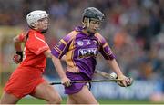 5 May 2013; Ursula Jacob, Wexford, in action against Denise Cronin, Cork. Irish Daily Star National Camogie League Div 1 Final, Cork v Wexford, Nowlan Park, Kilkenny. Picture credit: Brendan Moran / SPORTSFILE